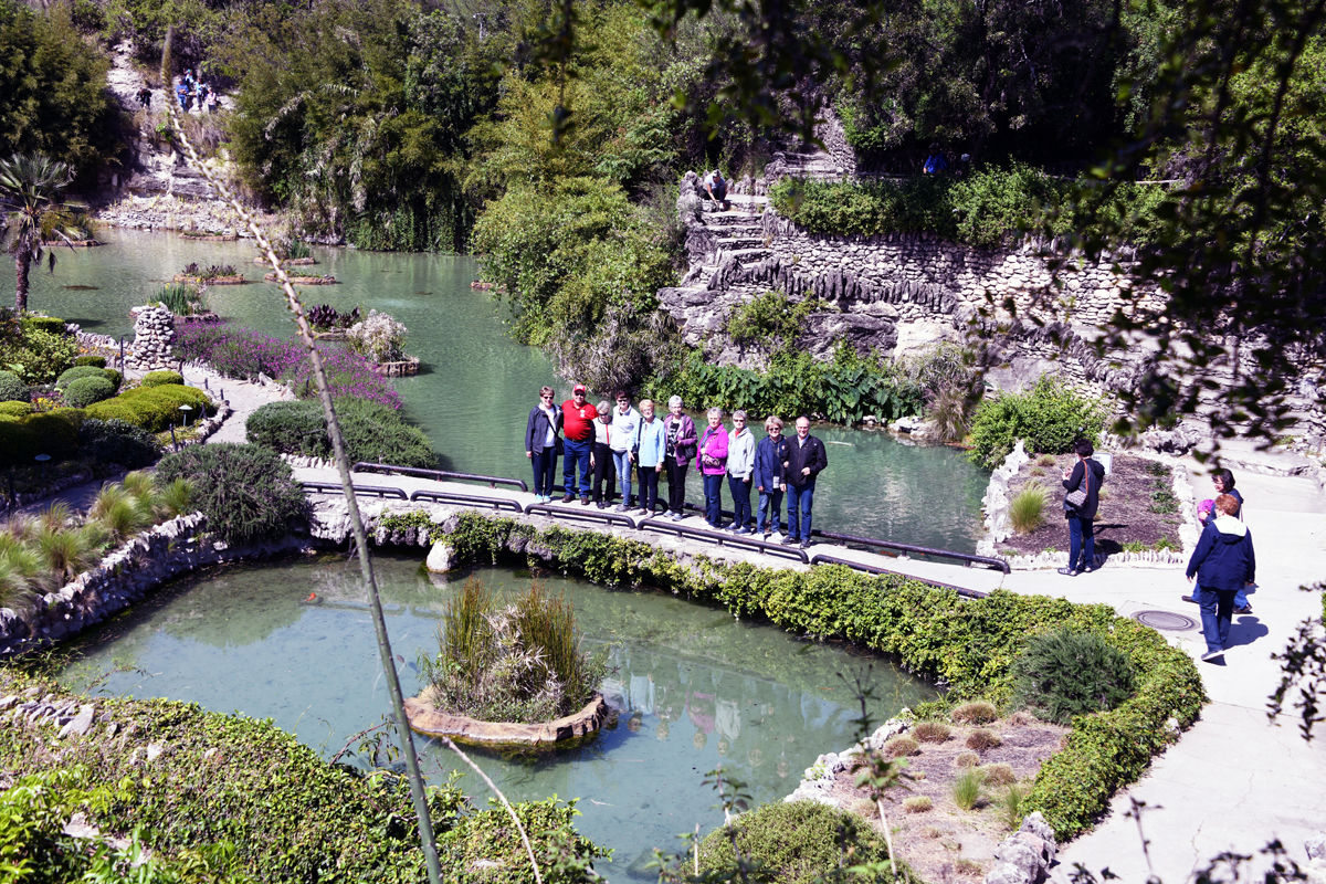 139 Fun Club visitors pose at the sunken Japanese Garden.JPG